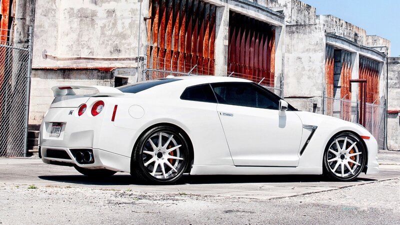 white sports car in urban setting