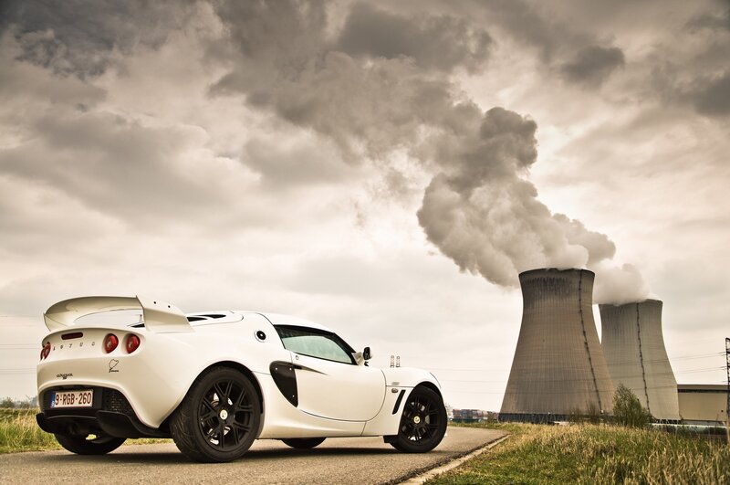 White sports car near power plant