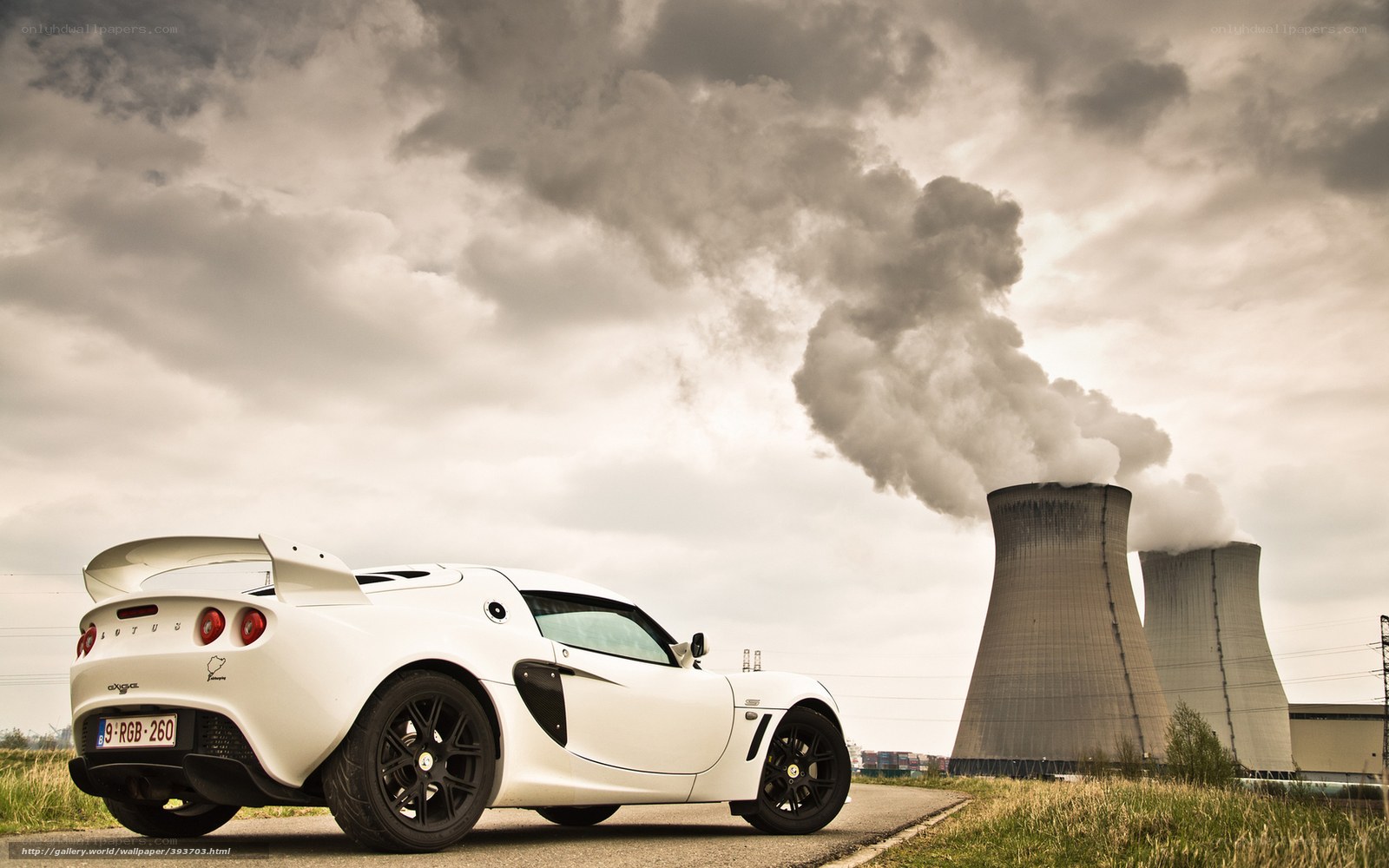 White sports car near power plant