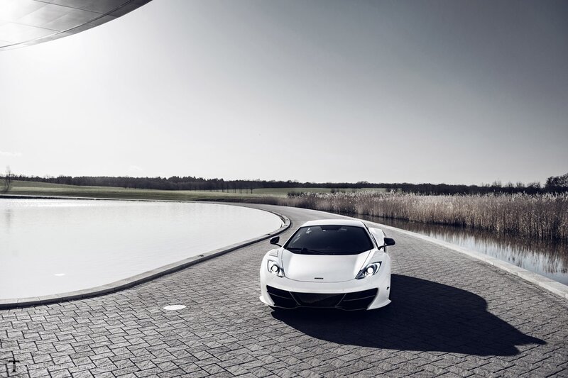 White sports car on a curved road