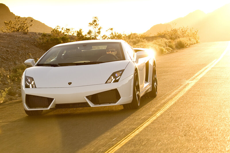 White sports car on a desert road