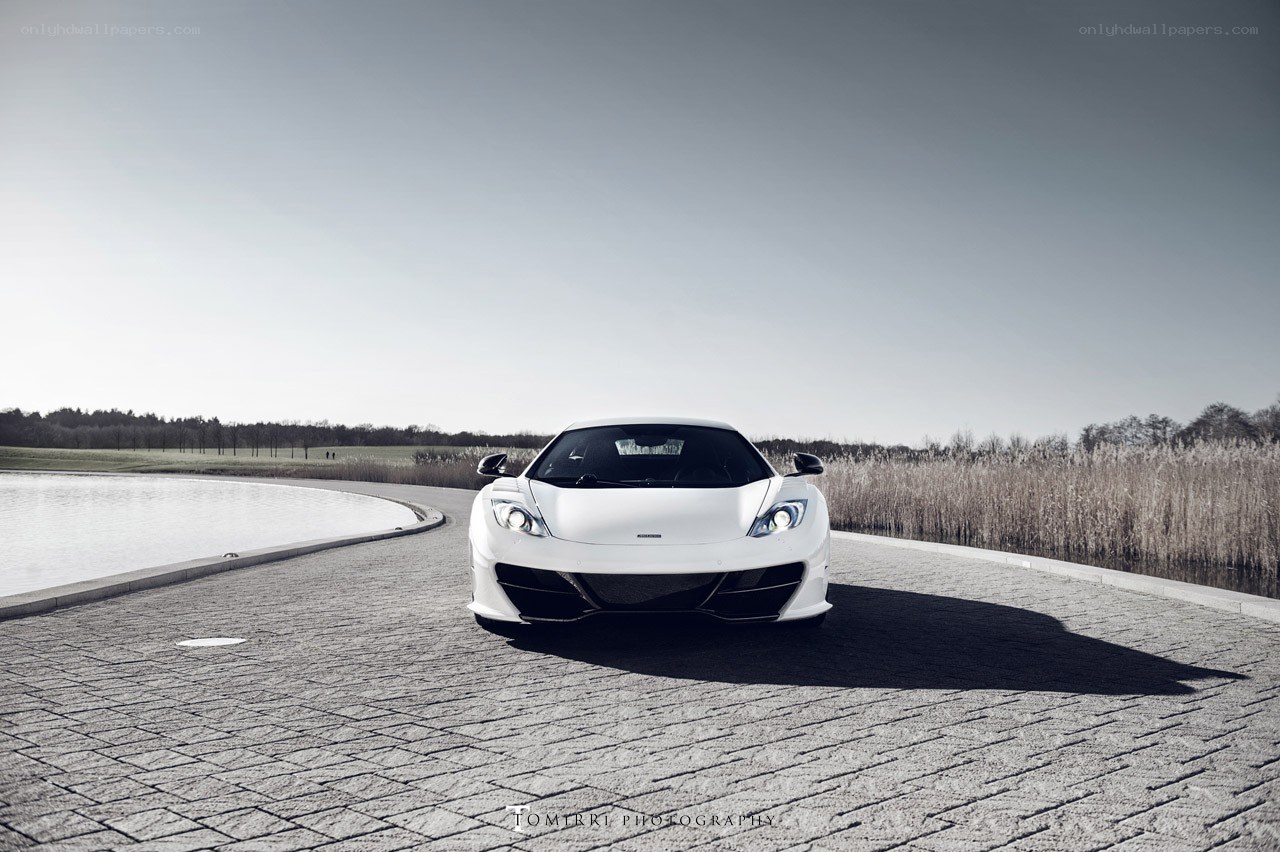 White sports car on a paved path