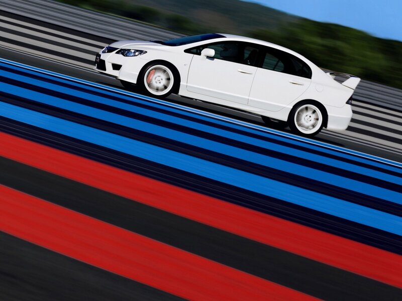 White sports car on a racetrack