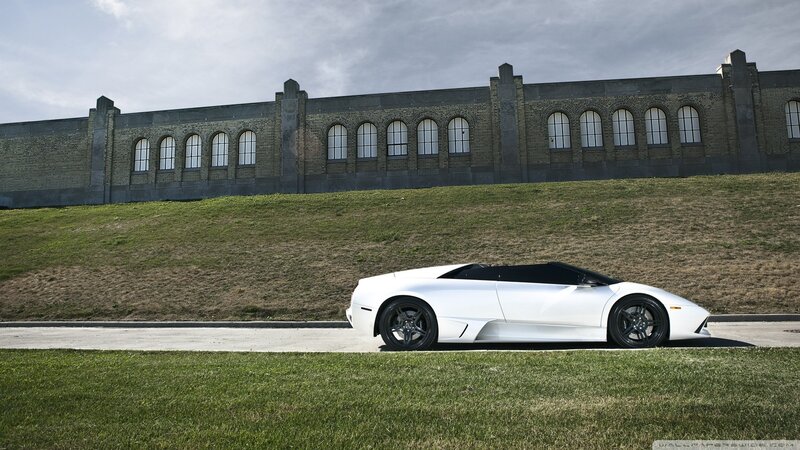 White sports car on a road