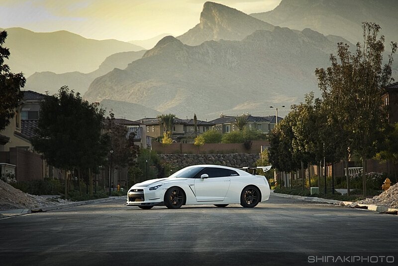 White sports car on a suburban street