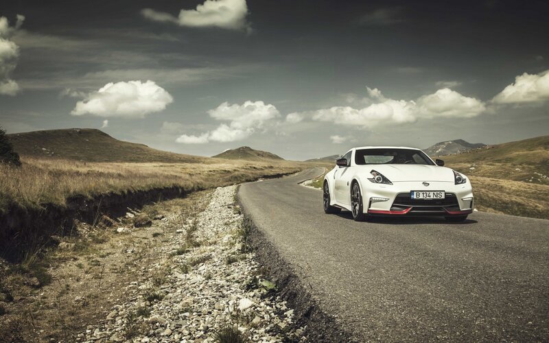 White sports car on a winding road