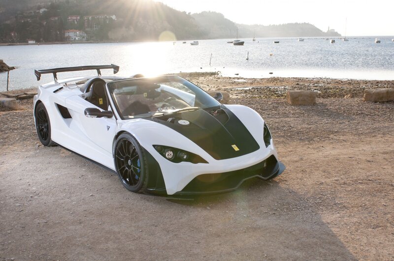 White sports car on beach