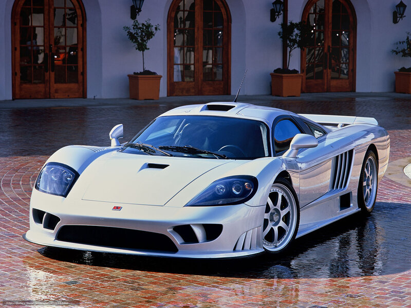 white sports car on brick driveway