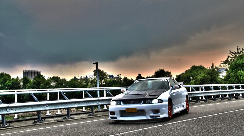 White Sports Car on Bridge — Gray