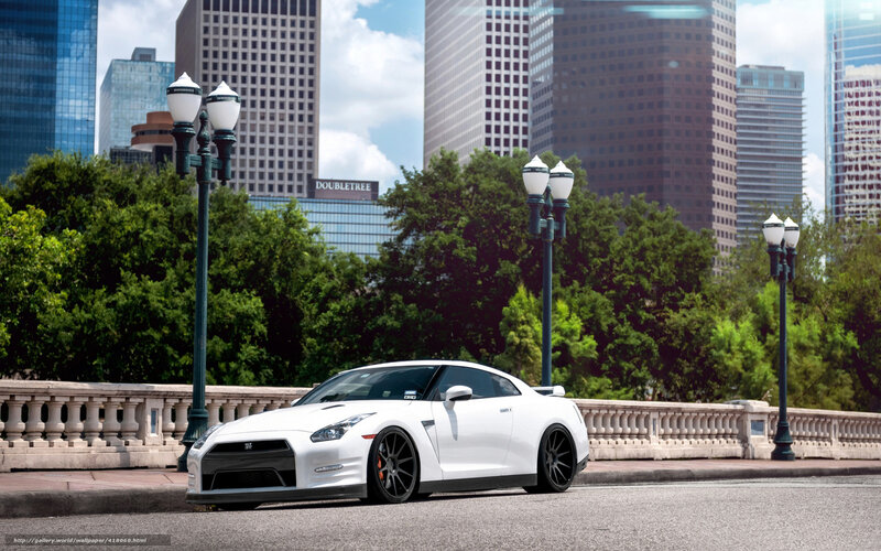 White sports car on city bridge