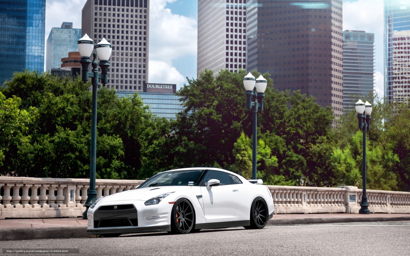 White sports car on city bridge