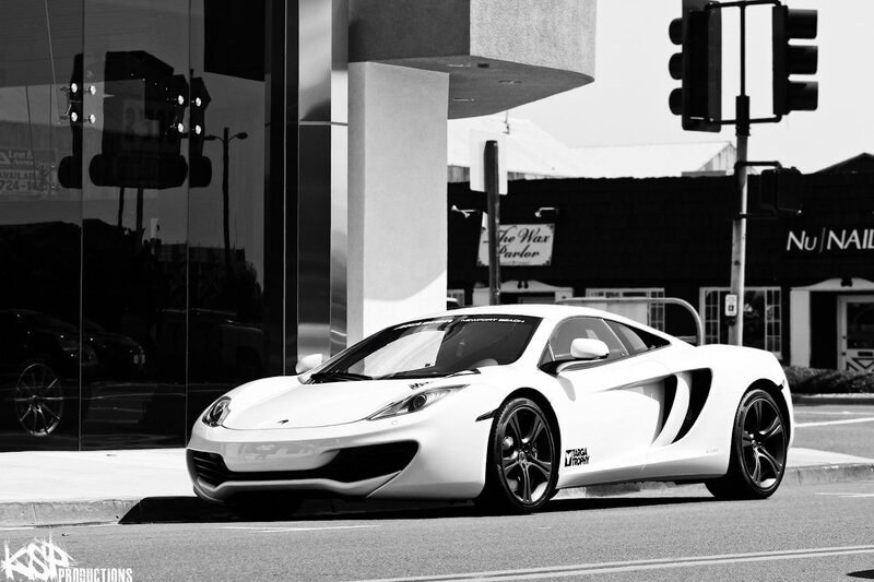 White sports car on city street