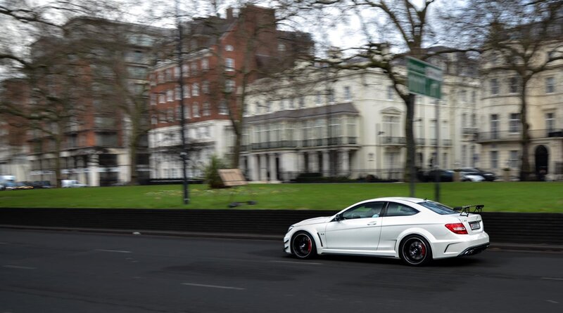 White sports car on city street