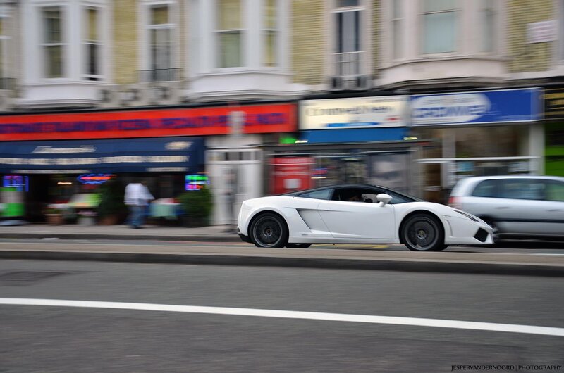 White sports car on city street
