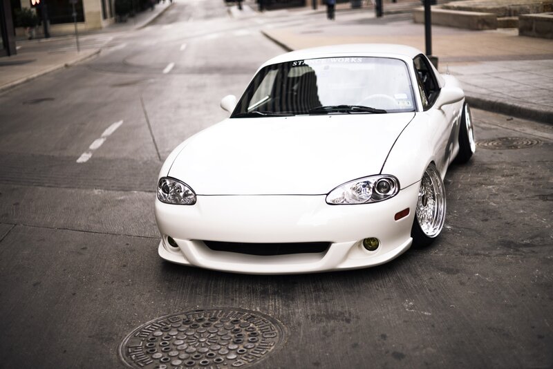 white sports car on city street