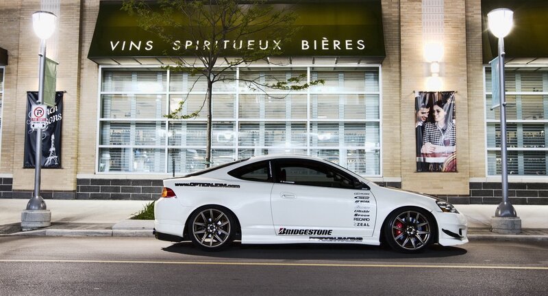 White sports car on city street