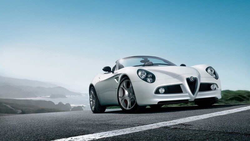 White sports car on coastal road