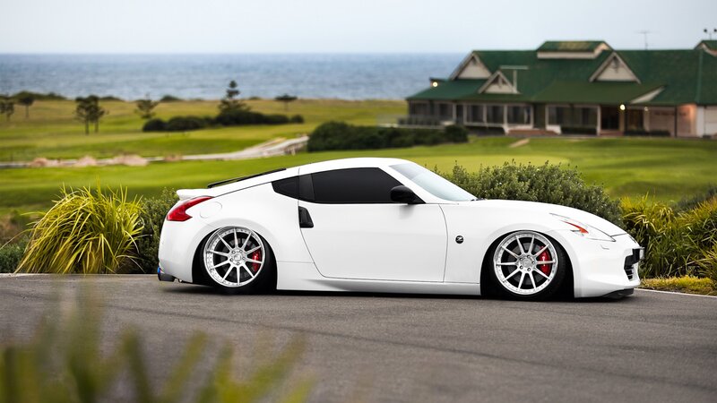 White sports car on coastal road