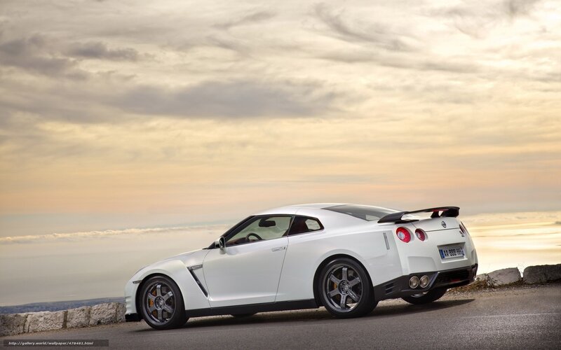 white sports car on coastal road