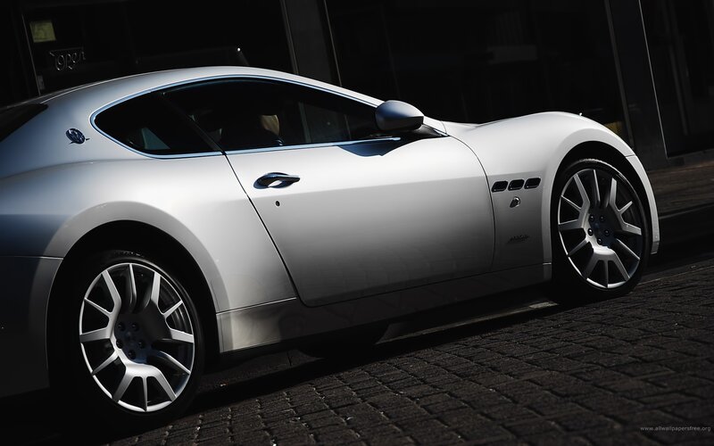 white sports car on cobblestone