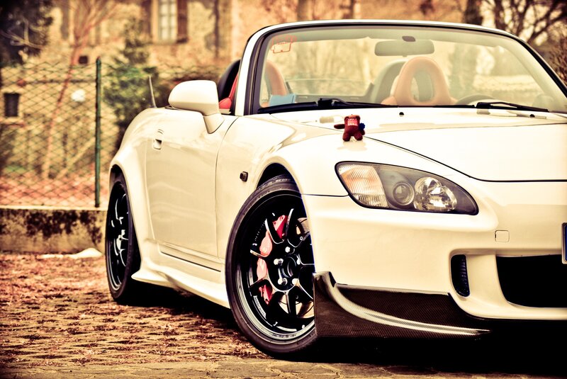 white sports car on cobblestones