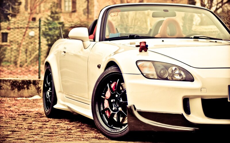 white sports car on cobblestones