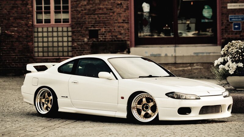 white sports car on cobblestones