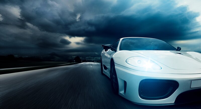 white sports car on dark road
