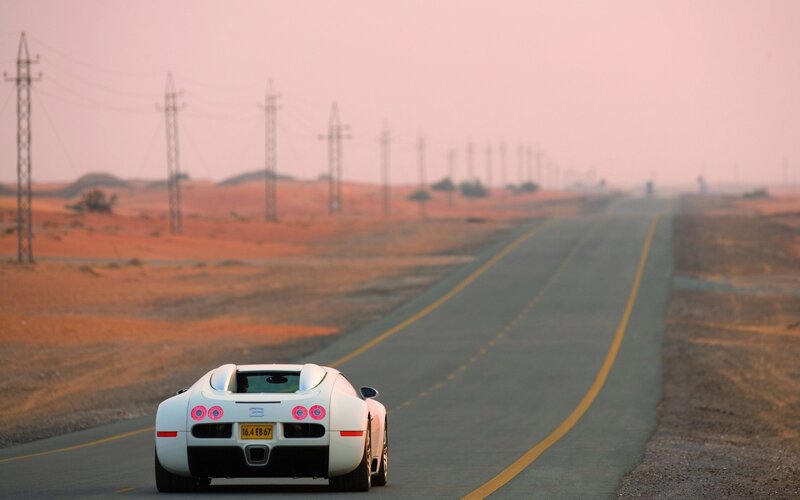 White sports car on desert road