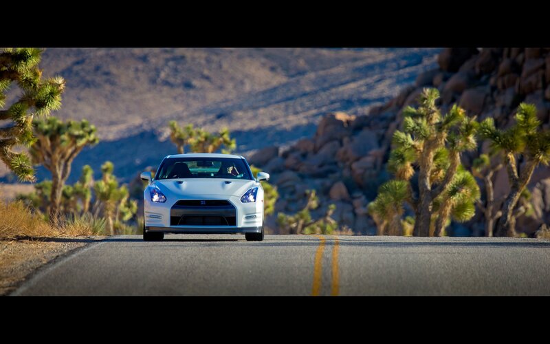 White sports car on desert road