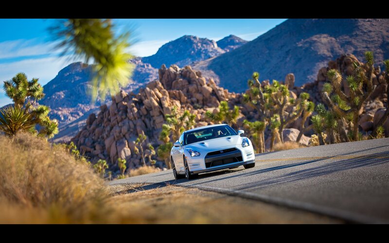 White sports car on desert road