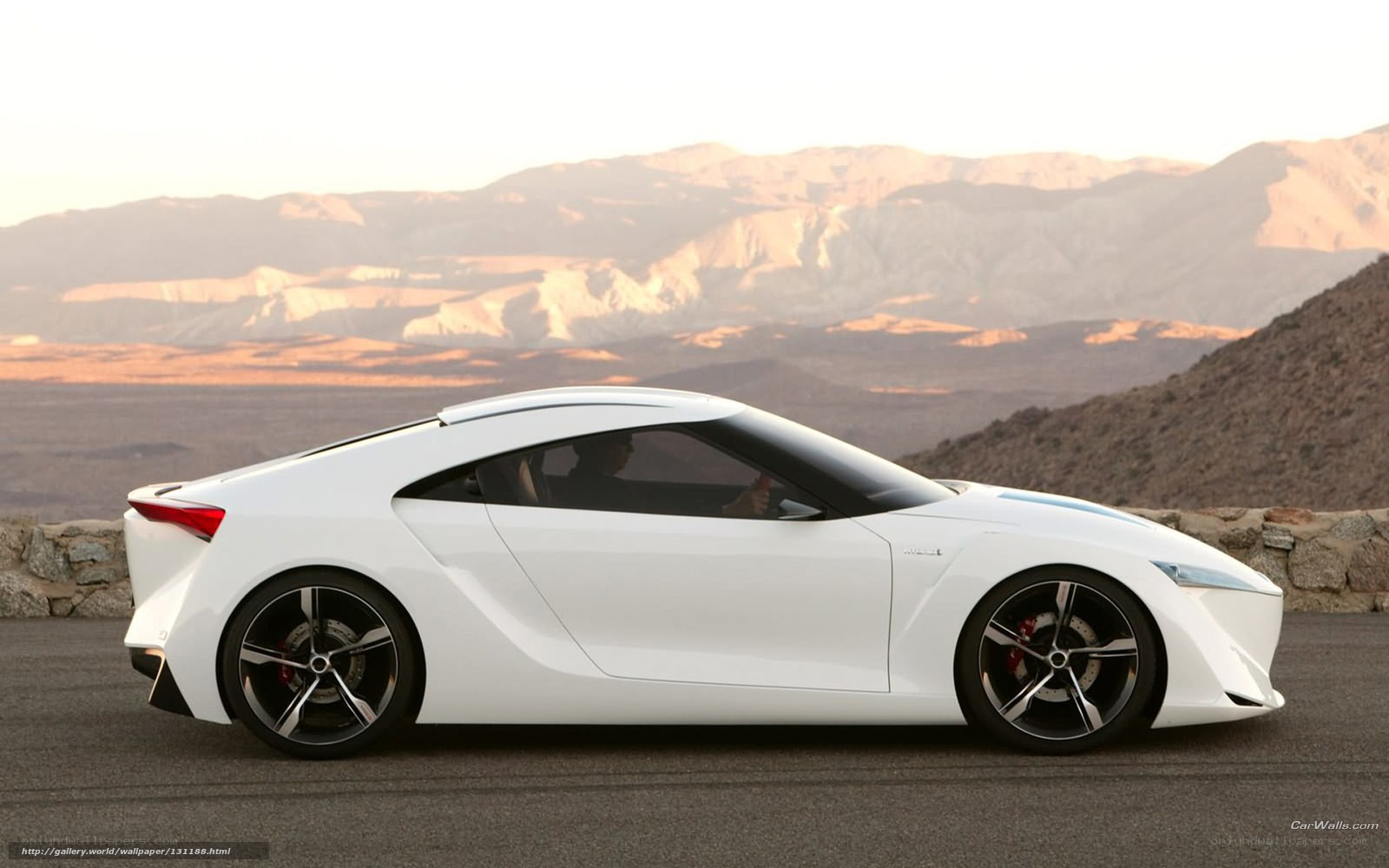 White sports car on desert road