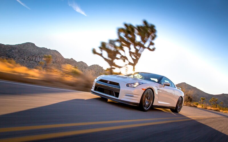 White sports car on desert road