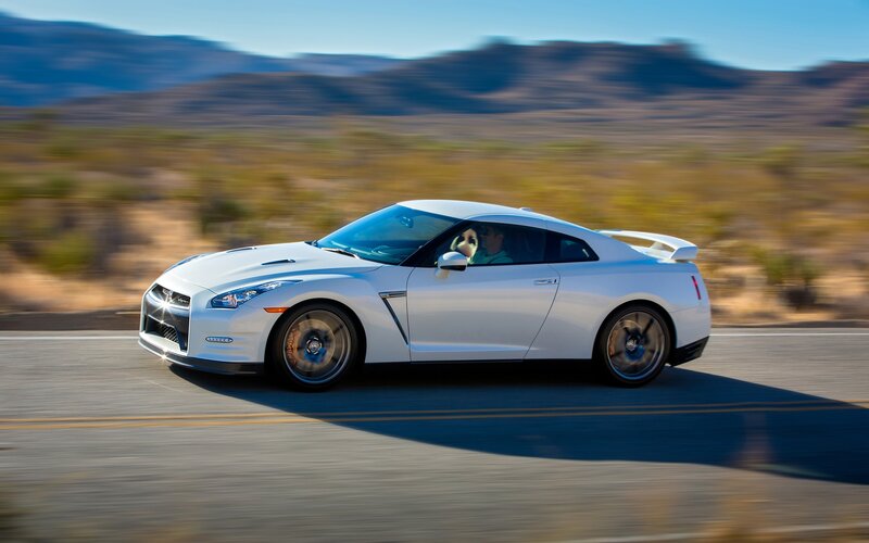 white sports car on desert road
