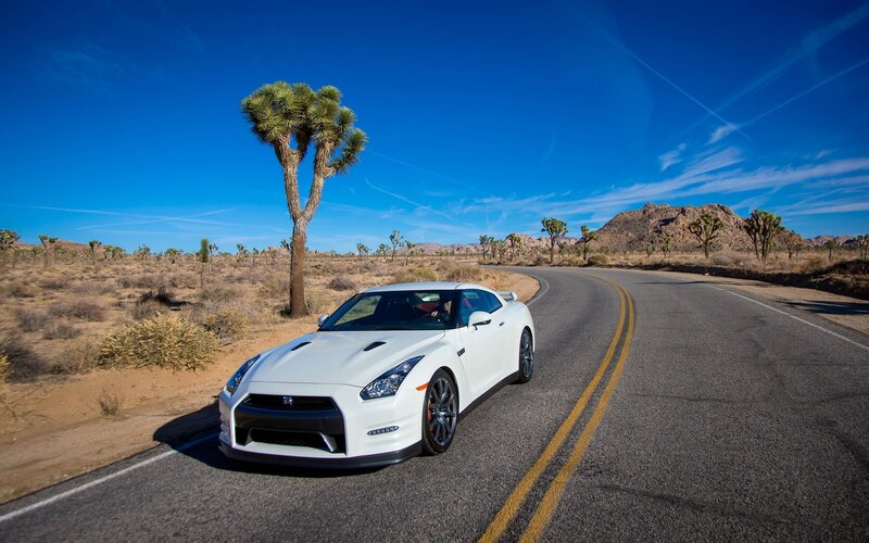 White sports car on desert road
