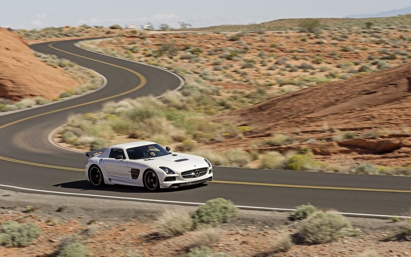 White sports car on desert road