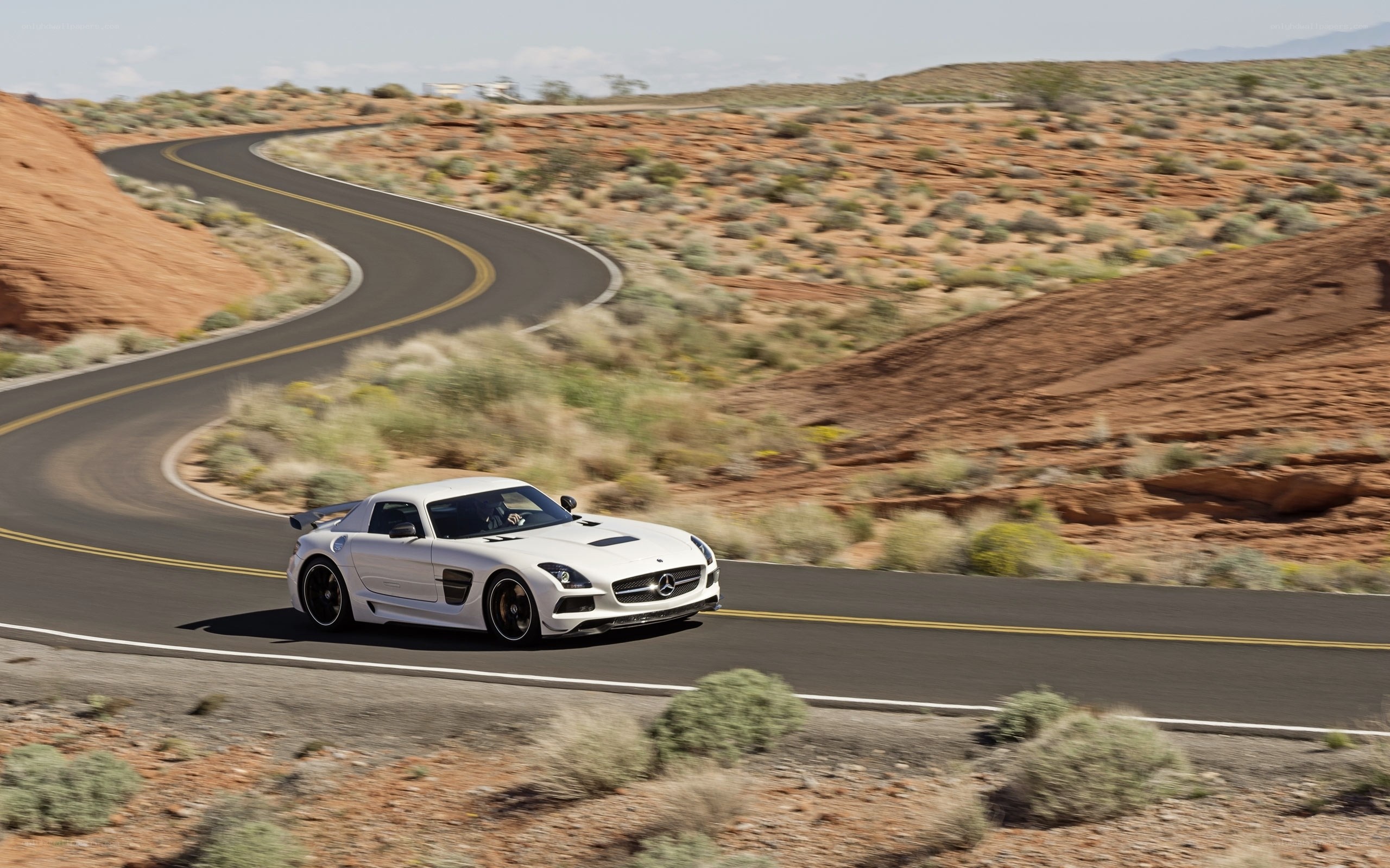 White sports car on desert road