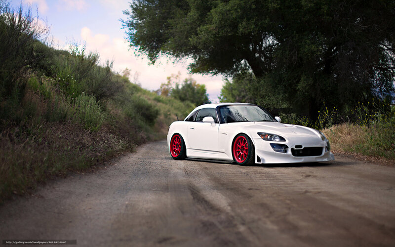 white sports car on dirt road