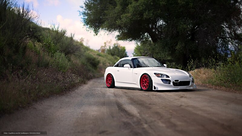 white sports car on dirt road