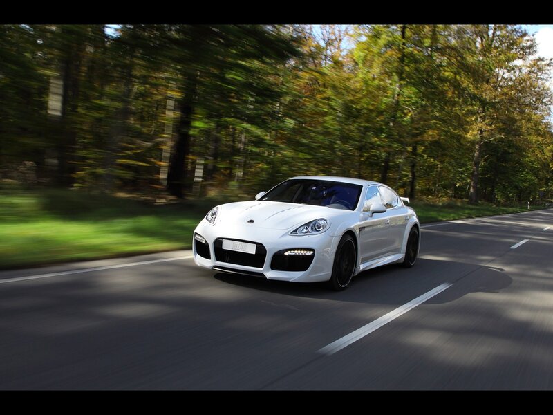white sports car on forest road