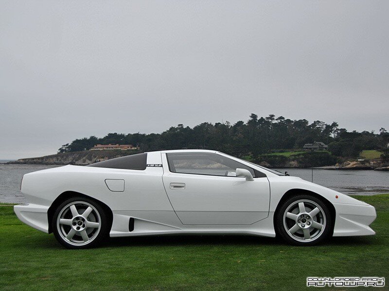 white sports car on grass