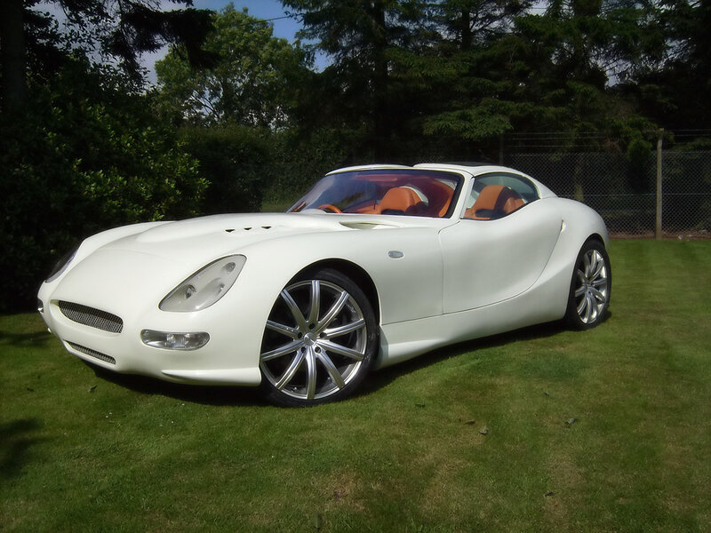 white sports car on grass