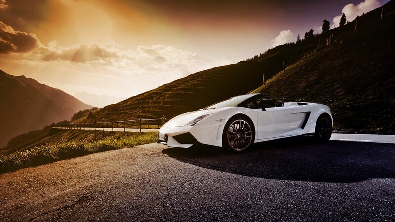 White sports car on mountain road