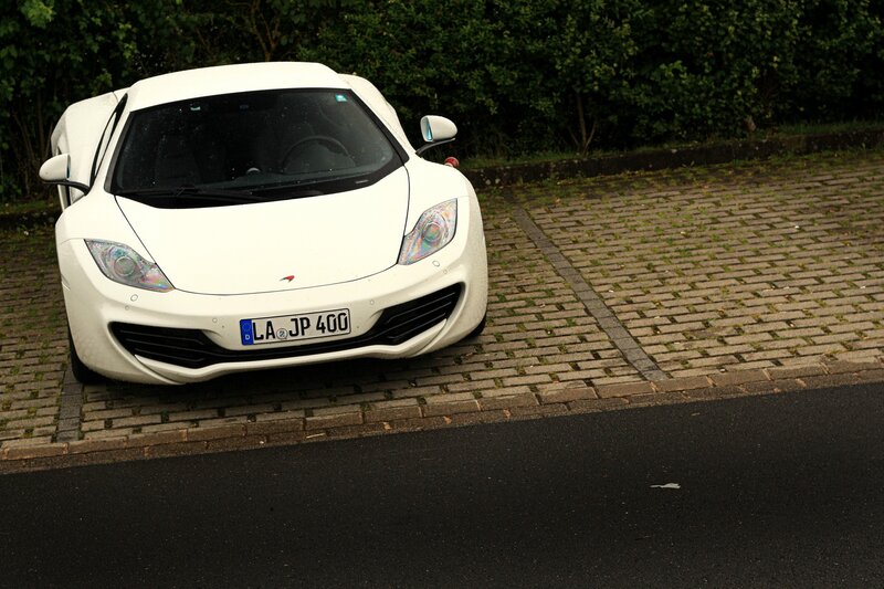 White sports car on pavement