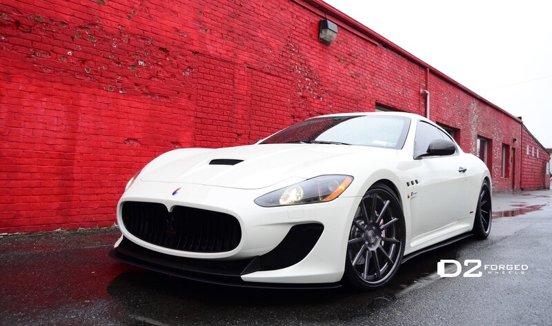 white sports car on red wall