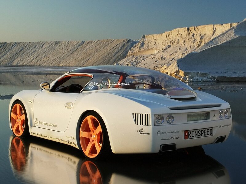 White sports car on reflective surface
