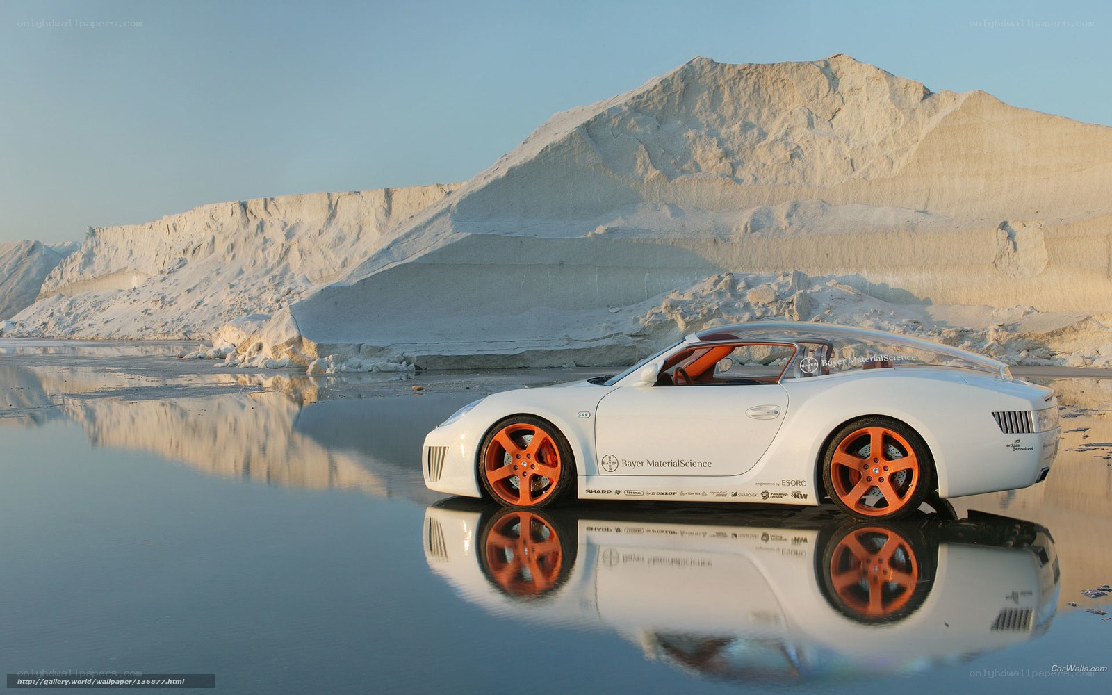 White sports car on reflective surface
