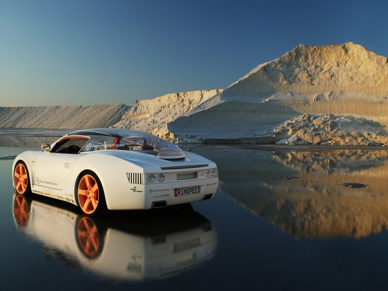 White sports car on reflective water