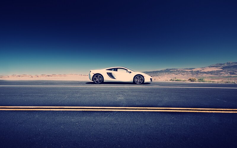 White Sports Car on Road — Blue, Serene, Afternoon