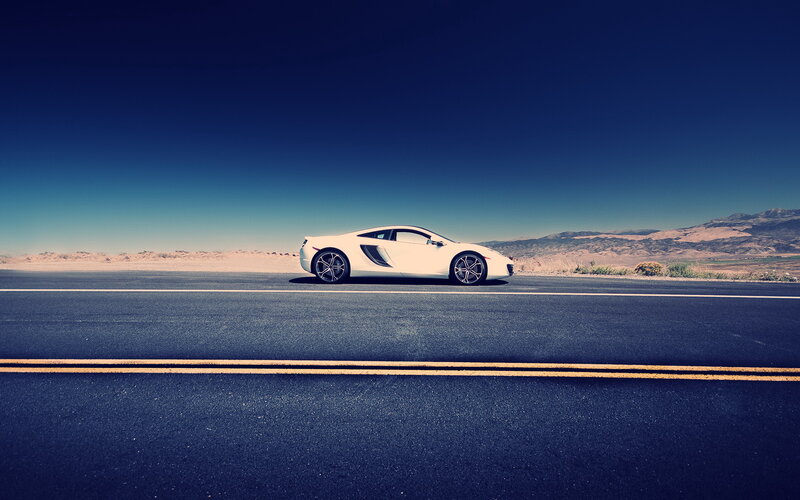 White Sports Car on Road — Blue